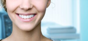 Beautiful smile of young woman with healthy white teeth