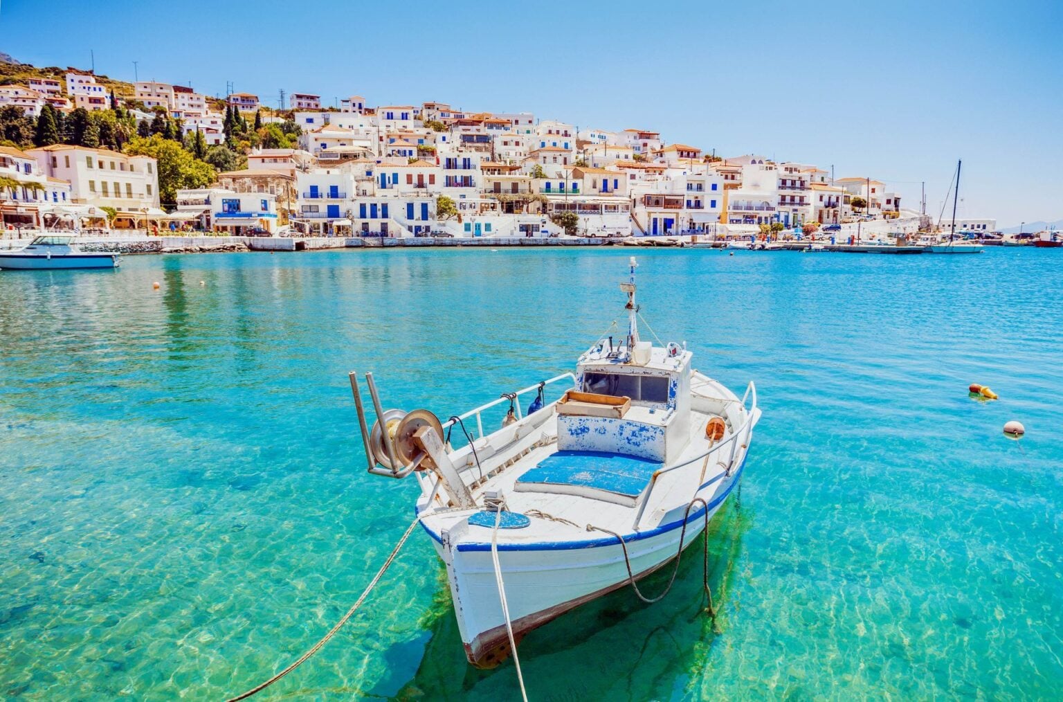 Andros Island Greece - Andros Town scenic view with boats and traditional Cycladic architecture