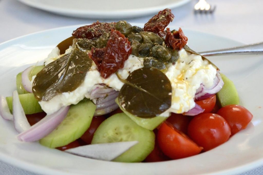 Traditional Greek Salad With Local Santorini Tomatoes And Feta Cheese