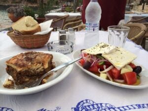 Greek Sunday lunch in London starts like this: moussaka and Greek salad on a taverna table