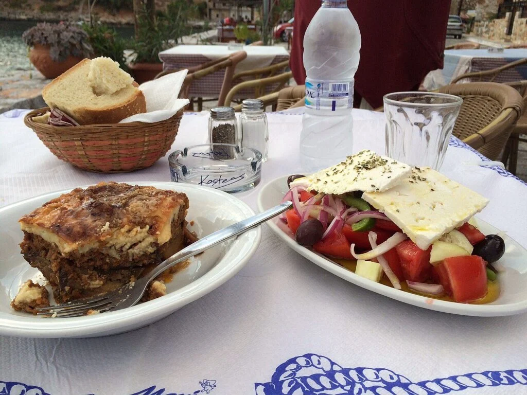 Greek Sunday lunch in London starts like this: moussaka and Greek salad on a taverna table